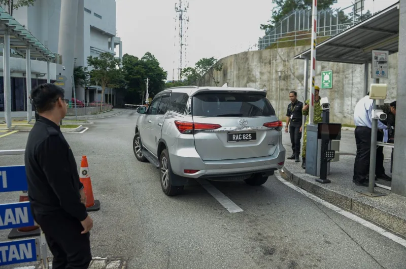 Daim's daughter charged in Malaysian court