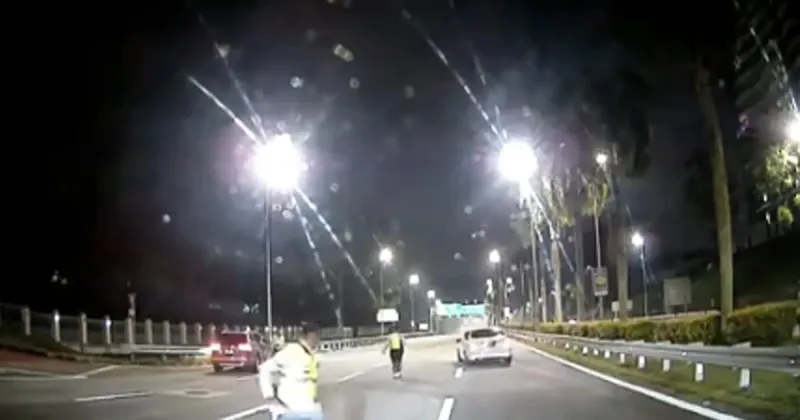 Driver arrested after pushing through KL roadblock