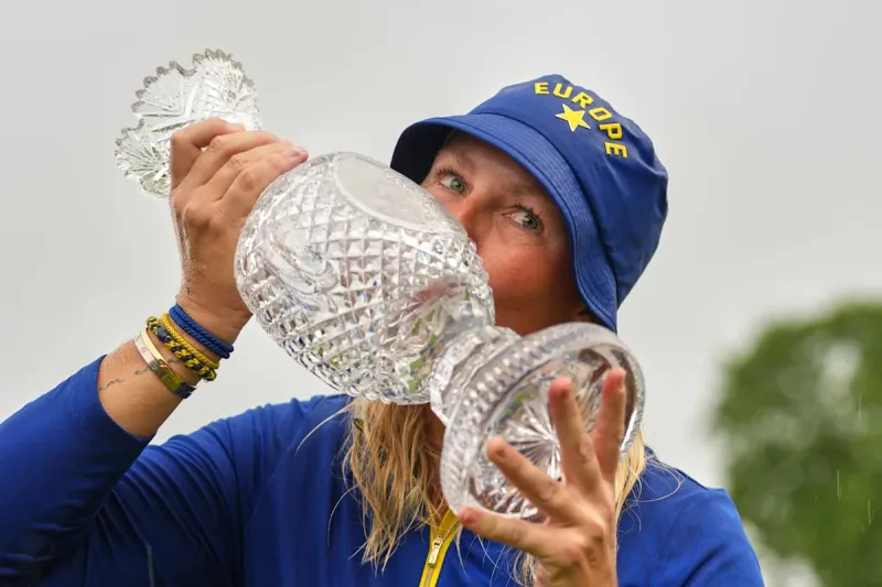 Europe beats US 15-13 in Solheim Cup. Lowry takes Irish Open by record 11 shots