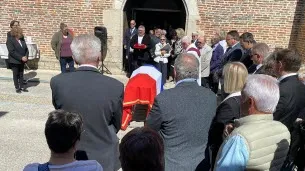 French Officials Pay Tribute to Jean Raquin