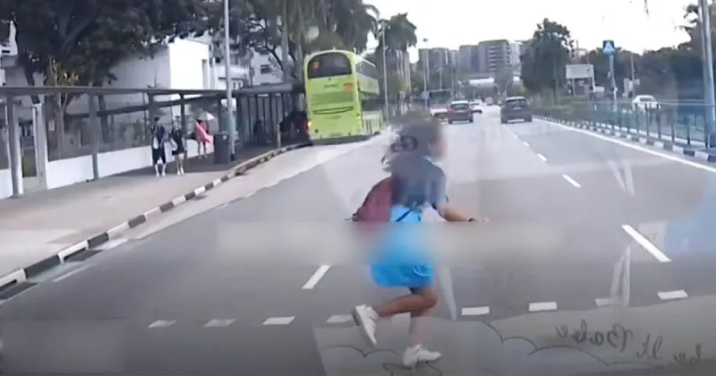 Girl dashes across Pasir Ris road, nearly hit by car