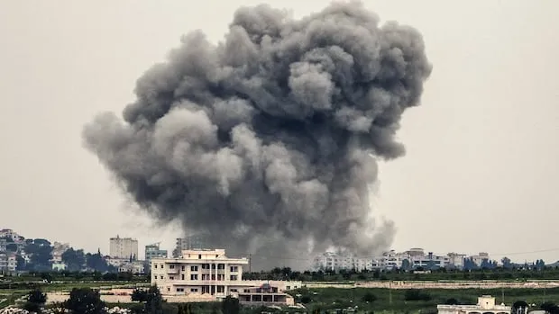 Israeli strikes kill 14 in Lebanon, warn of wider zone