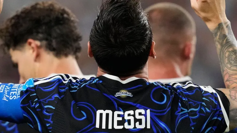 Messi sets record as Argentina top World Cup group