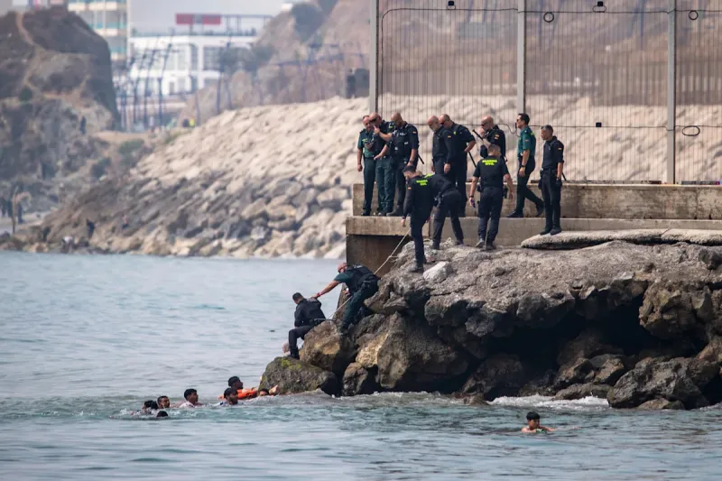 Migrants cross into Spain's Ceuta from Morocco