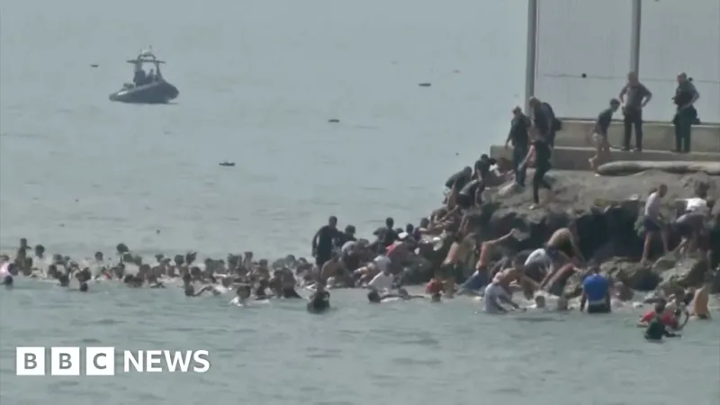 Migrants swim into Spanish enclave Ceuta from Morocco