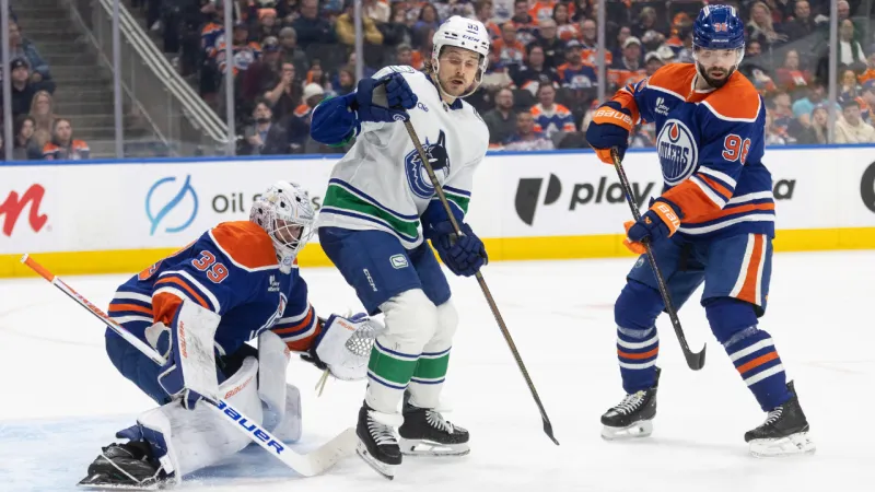 Oilers clinch playoff spot with win over Canucks