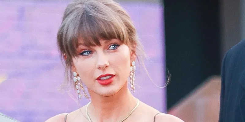Taylor Swift Attends Wedding in Floral Brocade Outfit