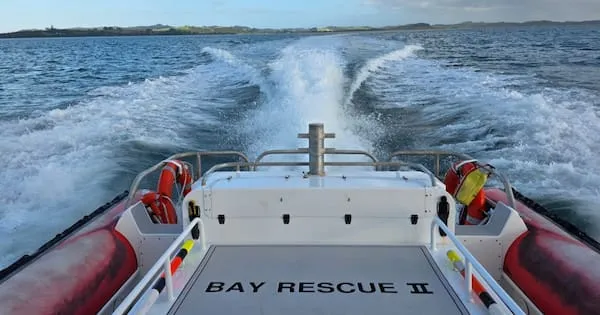 Three men rescued after boat capsizes in Bay of Islands